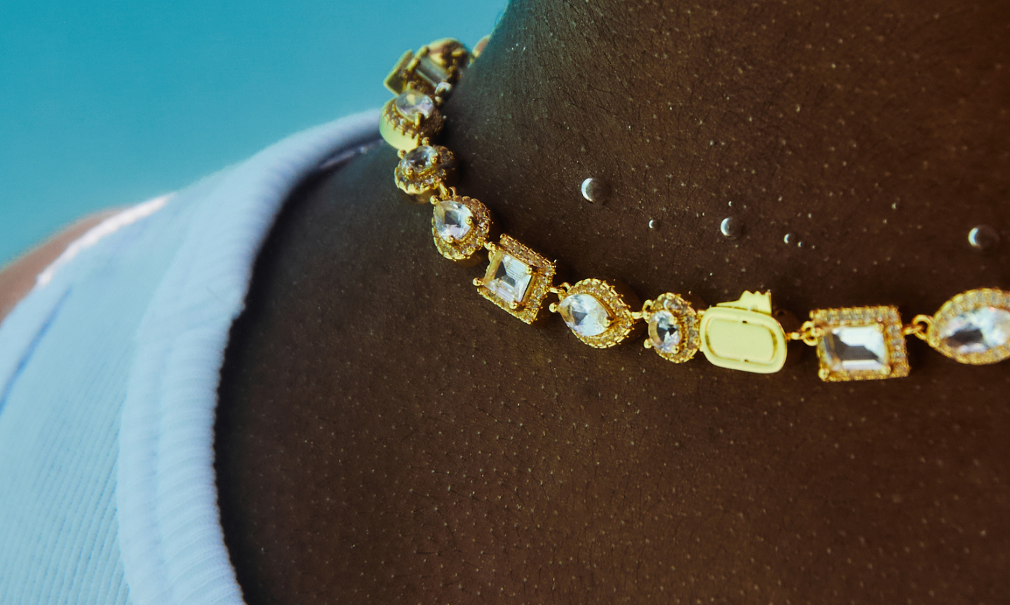 Men's ICED Gold Necklace sparkling and reflecting the light underwater 