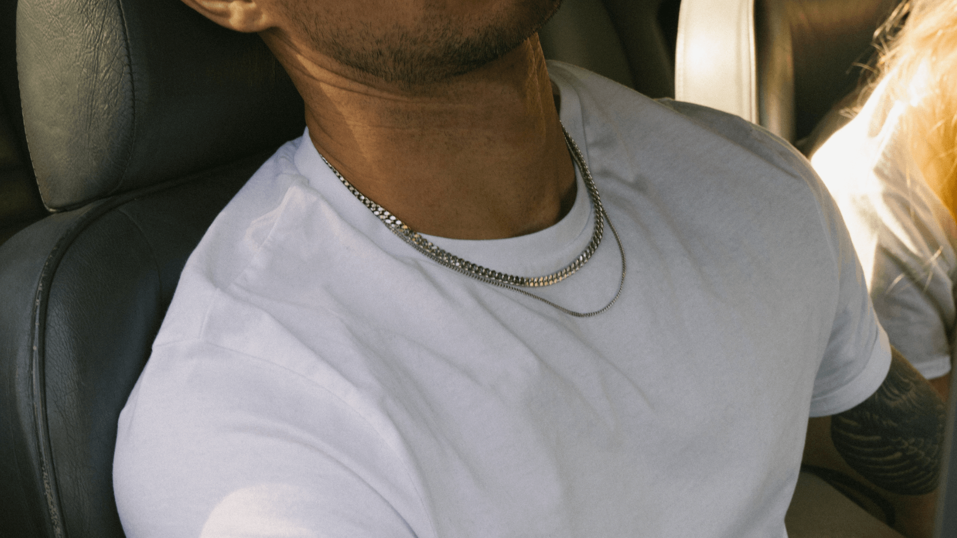 Man in white t-shirt wearing a Sterling Silver Cuban Link Chain